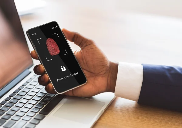 Man holding phone with fingerprint scanning smartp 2025 03 18 17 43 30 utc